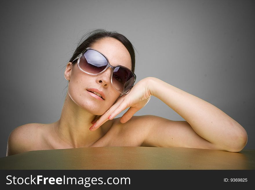 Portrait of beautiful young woman wearing sunglasses. Portrait of beautiful young woman wearing sunglasses