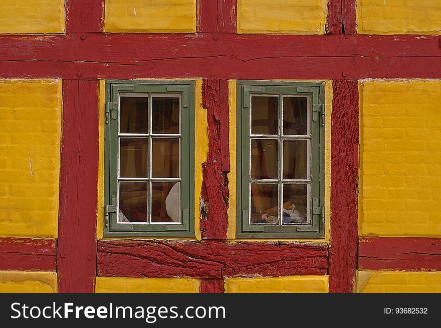 Windows in red and yellow building