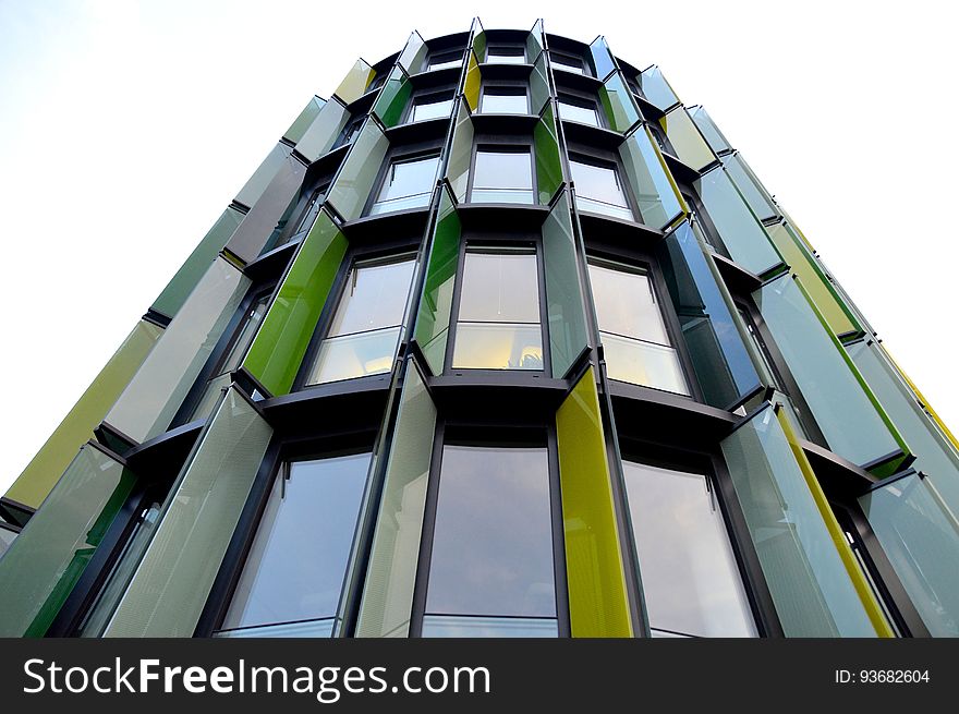 Colorful panels on exterior of contemporary building against overcast skies on sunny day. Colorful panels on exterior of contemporary building against overcast skies on sunny day.