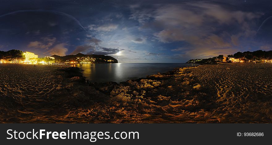 An empty beach at dusk.