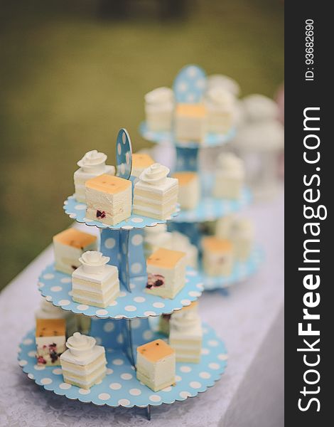 A tray of petit four birthday cake.