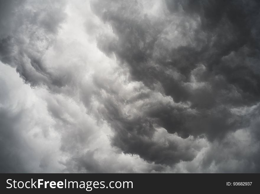 A black and white photo of storm clouds on the sky.
