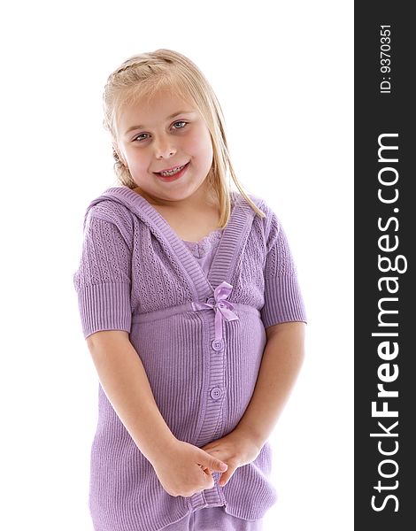 Cute little girl wearing a purple sweater.