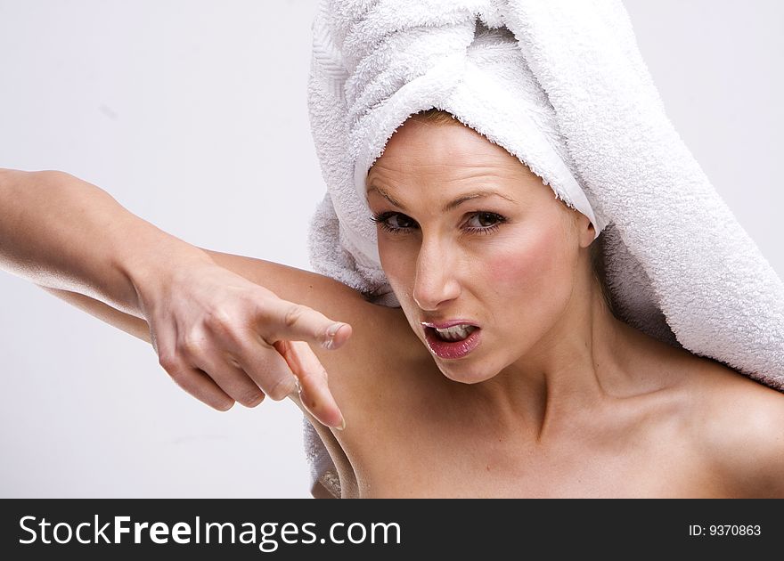 Frustrated house wife wearing white towel. Frustrated house wife wearing white towel