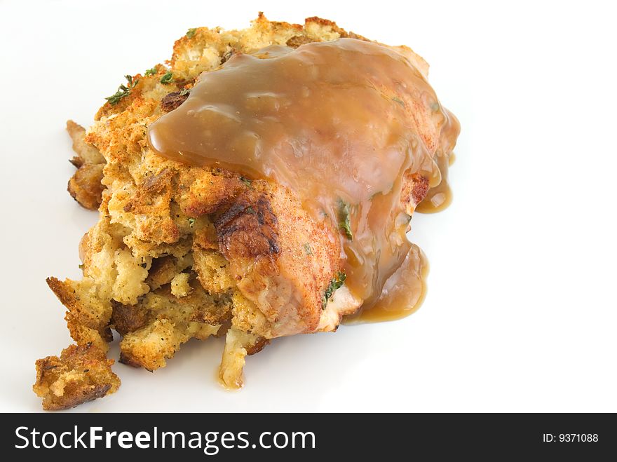 Stuffed pork chop covered in gravy