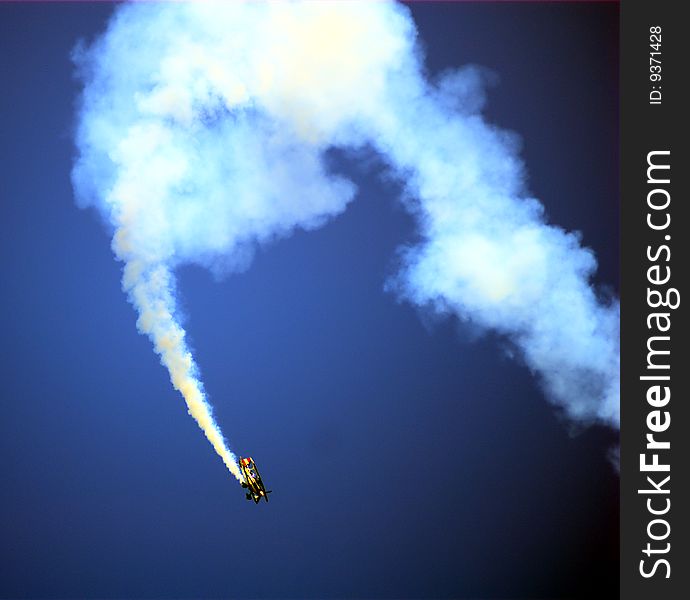 A stunt pilot plane during a flight show.