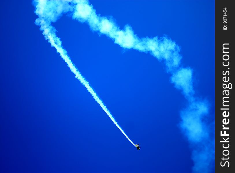 A stunt pilot plane during a flight show.