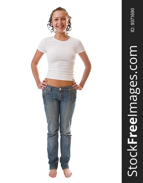 Girl in a white vest and jeans isolated on a white background. Girl in a white vest and jeans isolated on a white background