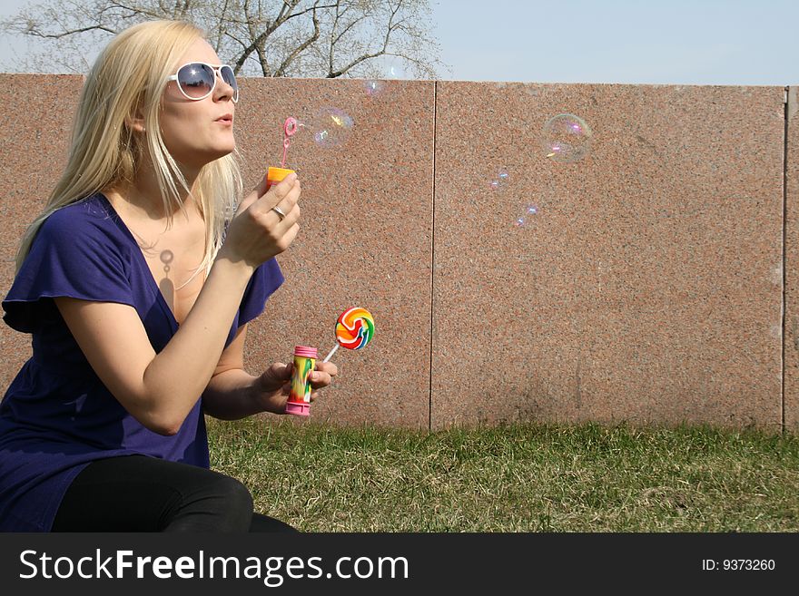 Funny Girl Blowing Soap Bubbles