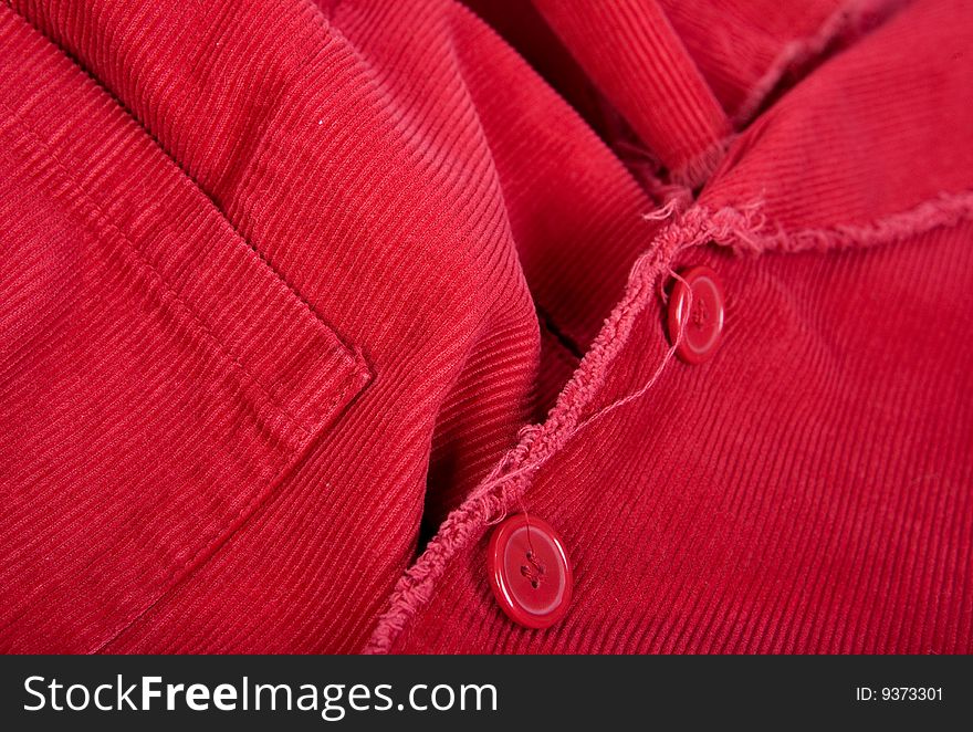 Pocket and button on red corduroy