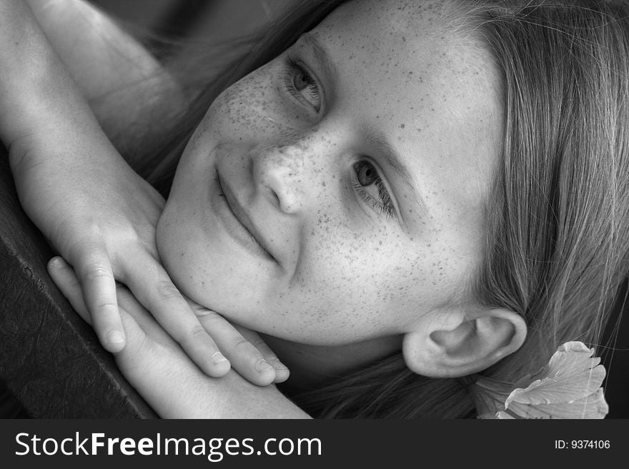 A white caucasian girl child relaxing. Picture in black and white. A white caucasian girl child relaxing. Picture in black and white