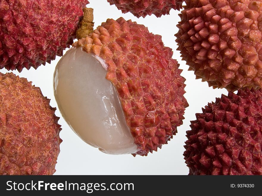 A selection of lychees against a white background. A selection of lychees against a white background