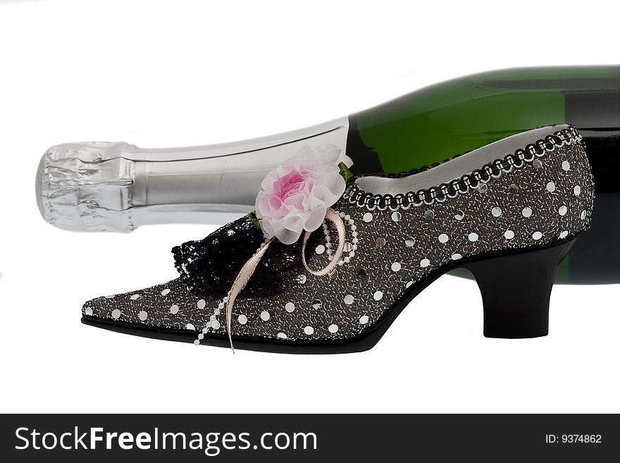 Elegant lady shoe with champagne, isolated against white background