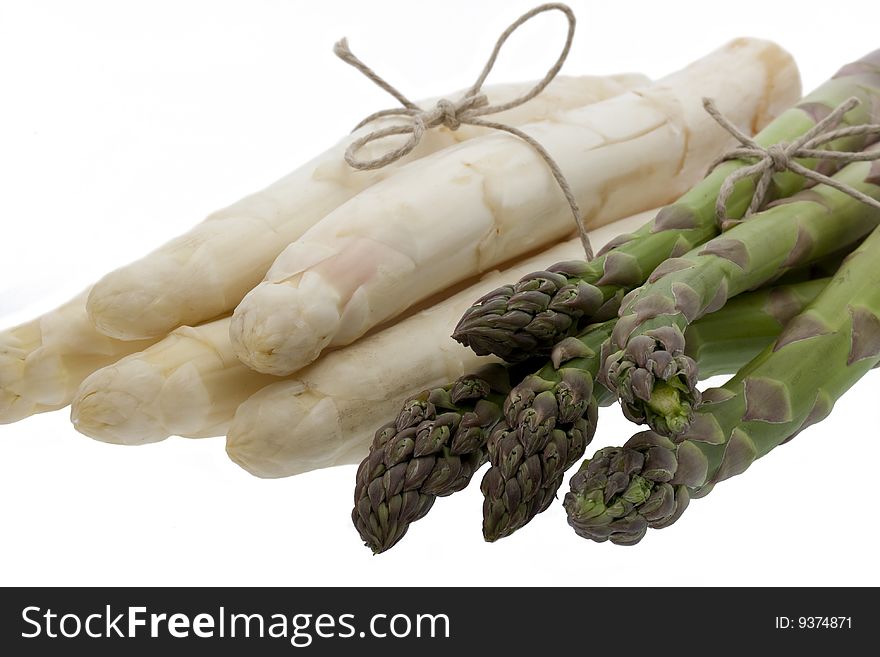 White and green asparagus, isolated against white background