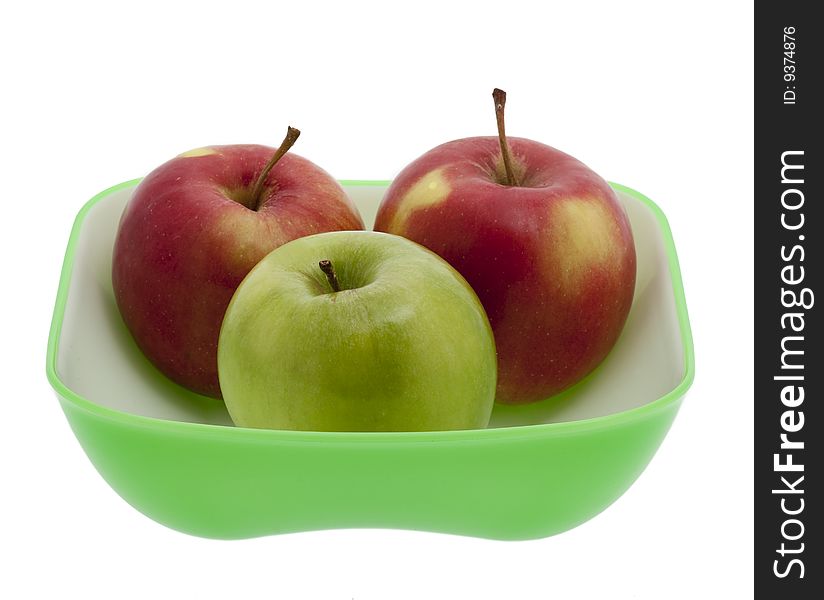 Apple on plate, healthy fruit against white background