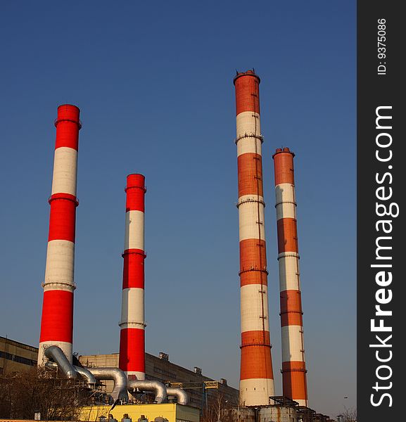 4 plant pipes at the blue sky background. 4 plant pipes at the blue sky background.