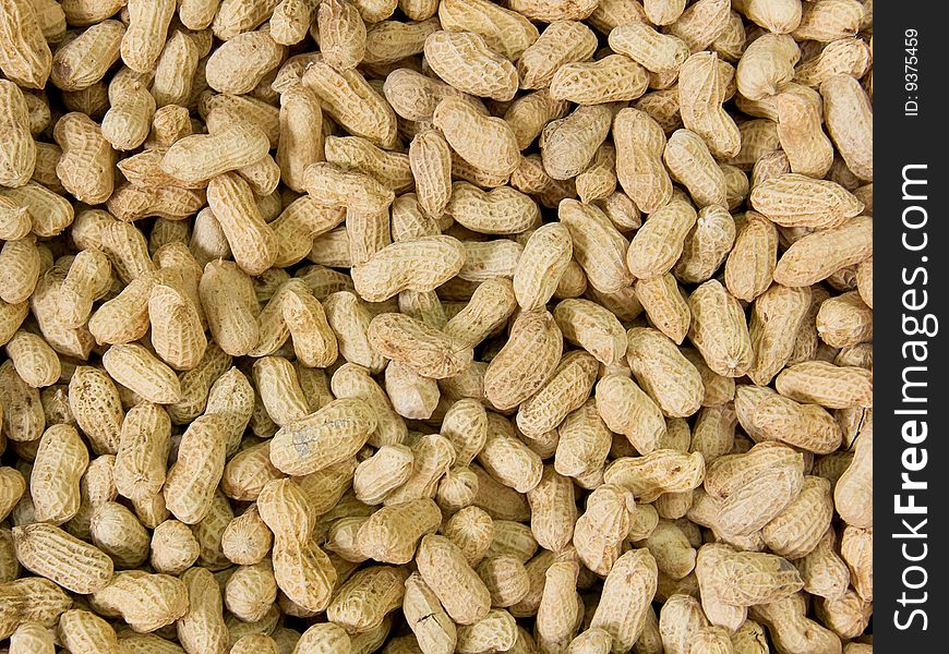 Close up on a pile of peanuts ready for sale.