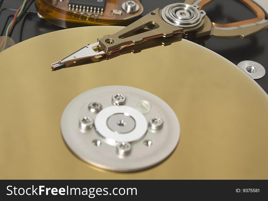 Closeup of the platters and read/write head of a computer hard drive. Closeup of the platters and read/write head of a computer hard drive