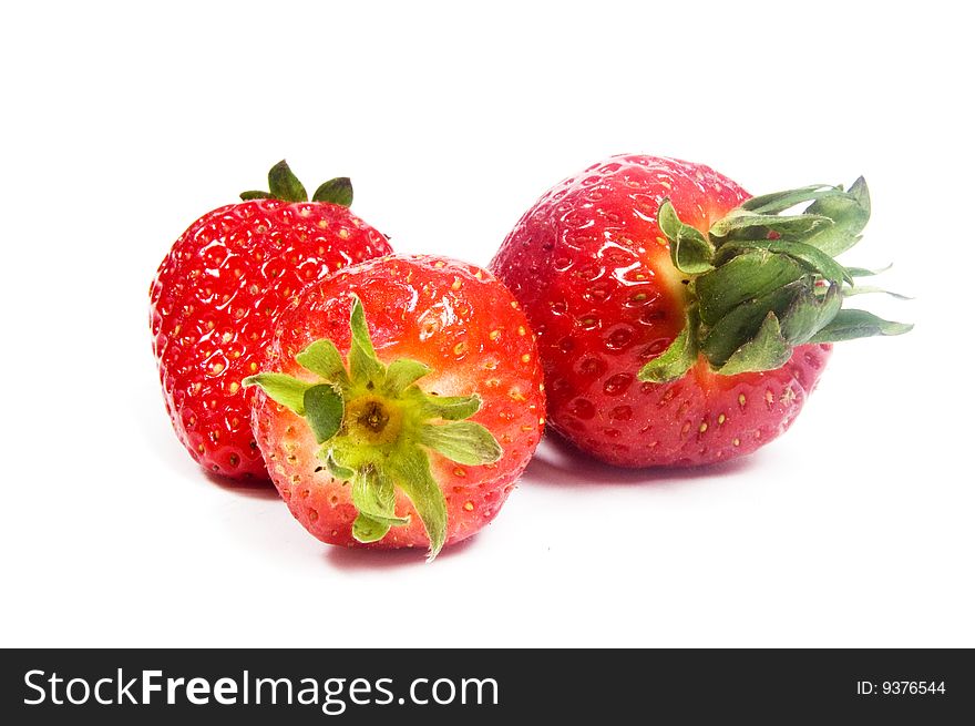 3 Strawberries On A White Background