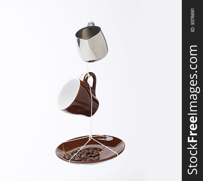 Espresso utensils hanging isolated on white background