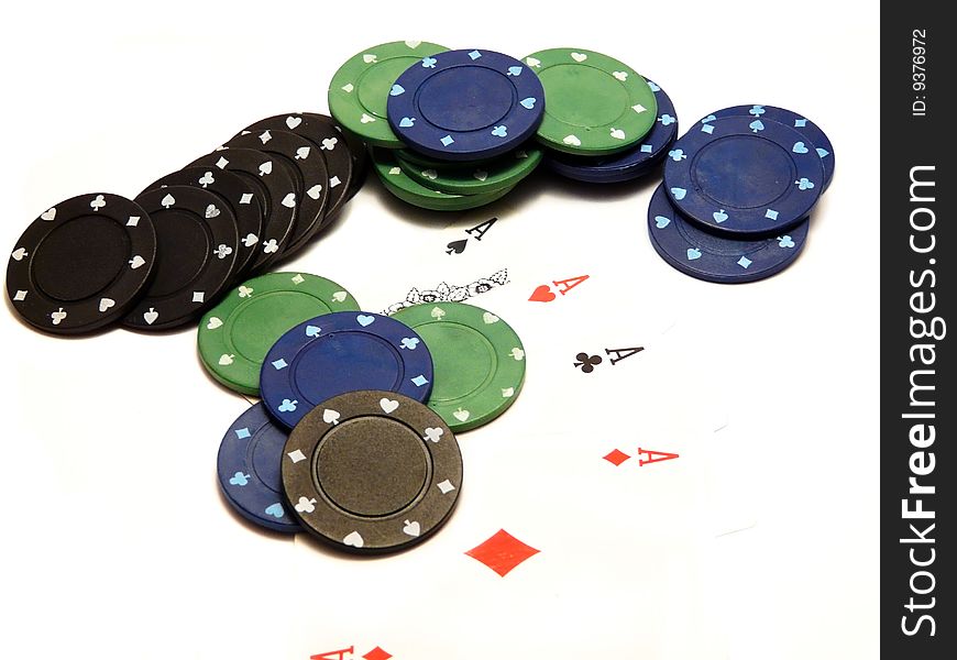 Four aces and casino chips isolated over white