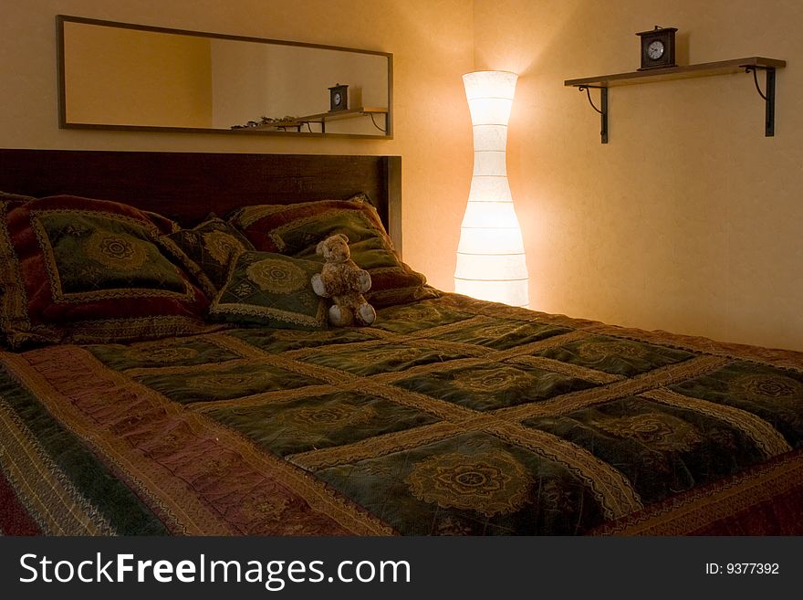 Bedroom with lamp and clock