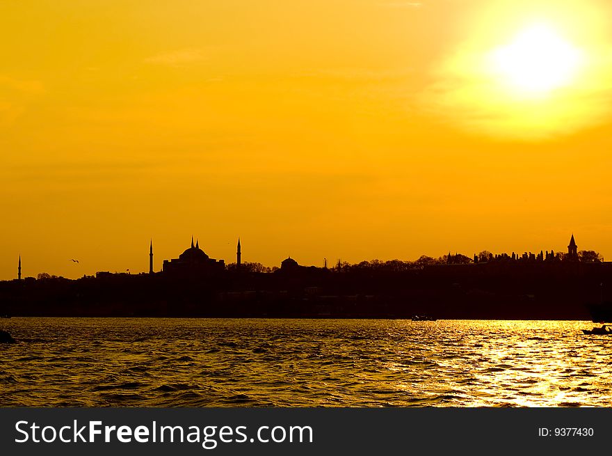 The view of Blue mosque and Hagia Sofia after sunset from Uskudar