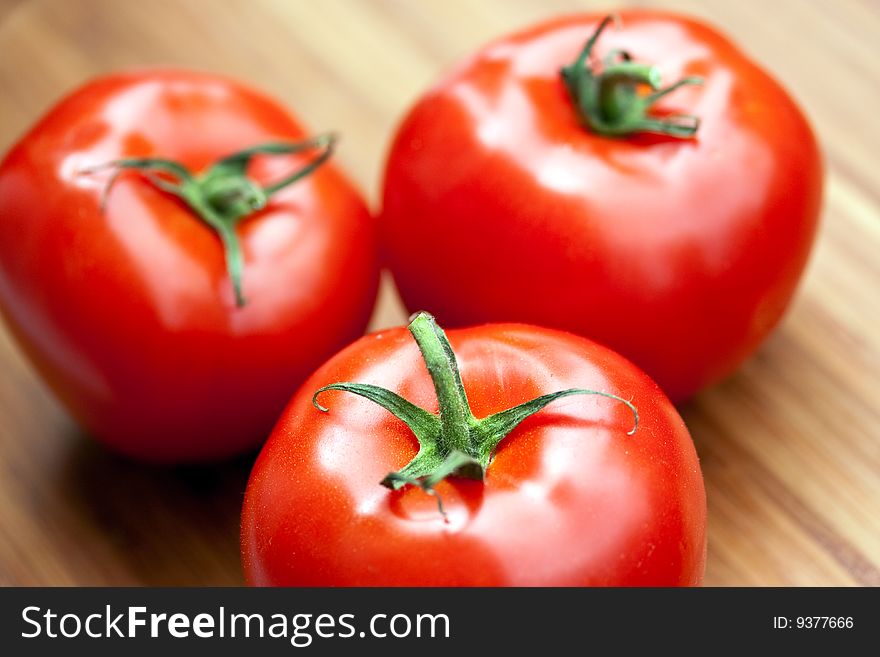 Ripe Beef Tomatoes On The Wooden Background.