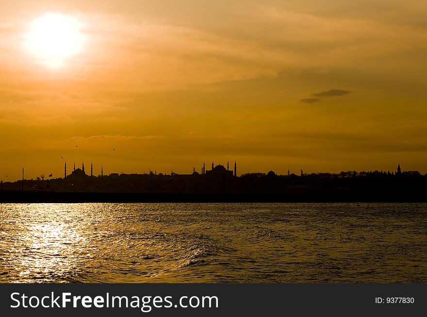 The view of Blue mosque and Hagia Sofia after sunset from Uskudar