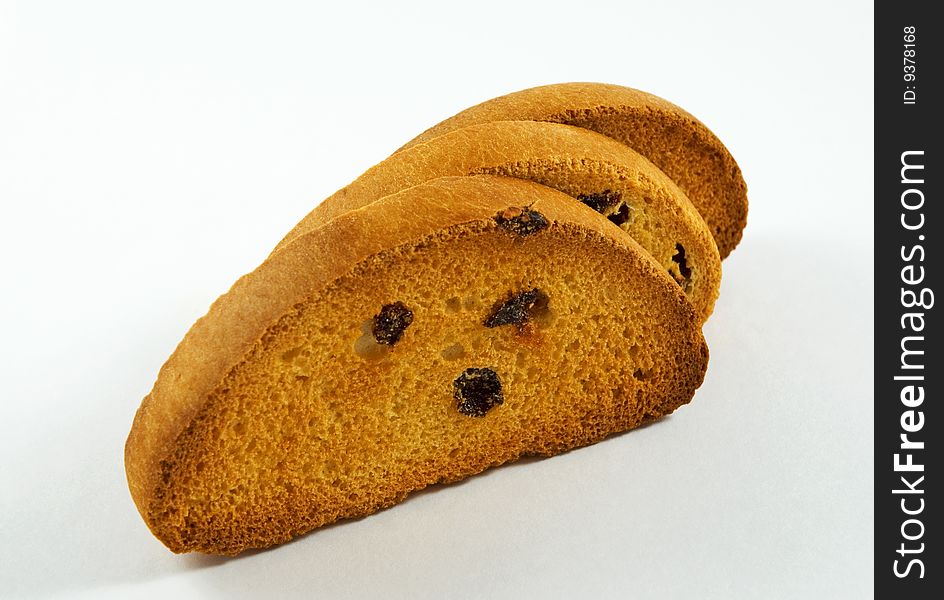 Three crackers with raisins, isolated on a white background