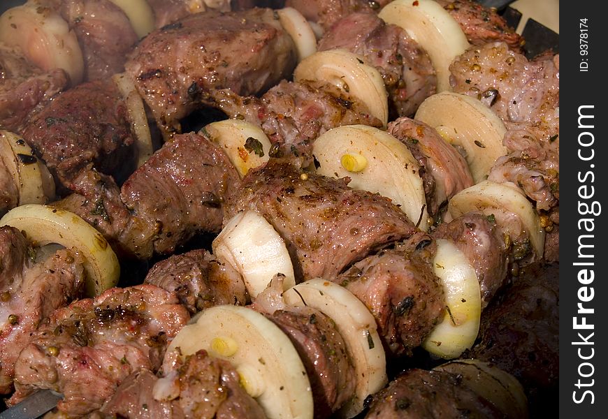 Five appetizing kebabs on grill
