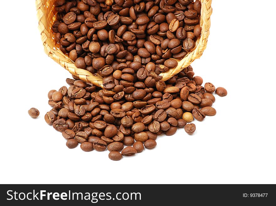 Brown grains of fried not ground coffee in the form of a heap and signs.