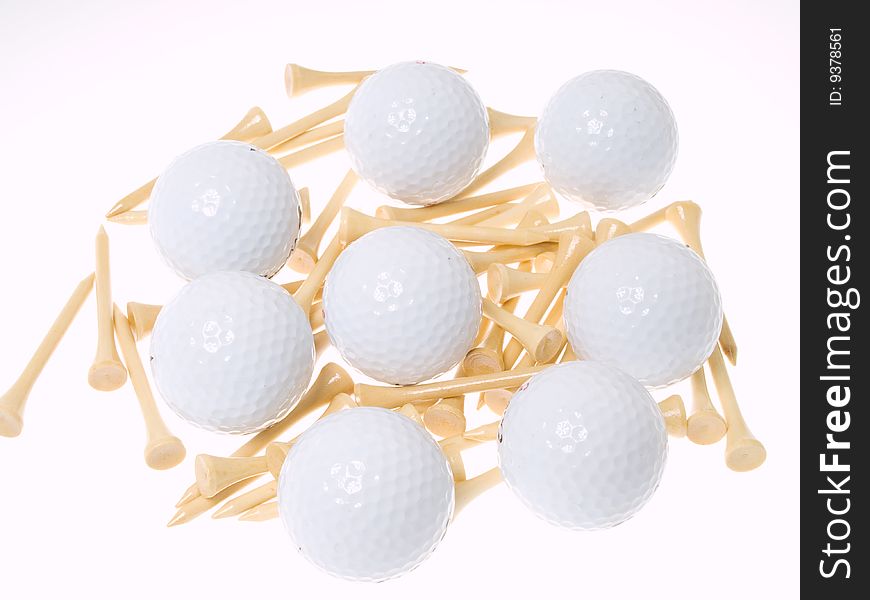 Golf balls with tees isolated on white