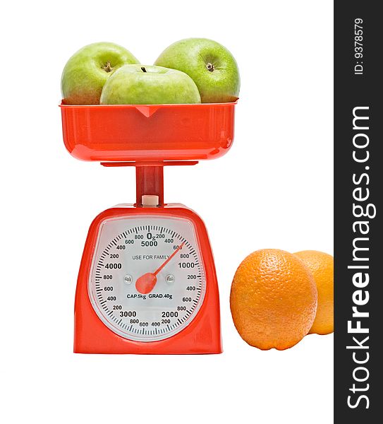 Red kitchen scale weighting apples