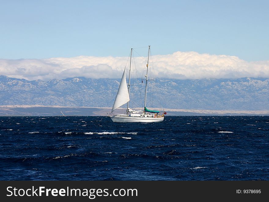 White yacht sailing in Croatia on the sea.