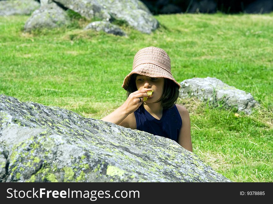 Girl with hat while eating. Girl with hat while eating