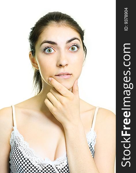 Portrait of a beautiful young surprised woman against white background