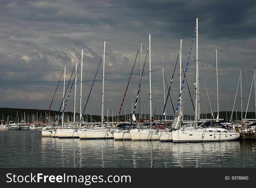 The yacht marina with dark sky background. Croatia.