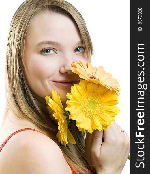 Smiling girl with yellow flowers on white background. Smiling girl with yellow flowers on white background