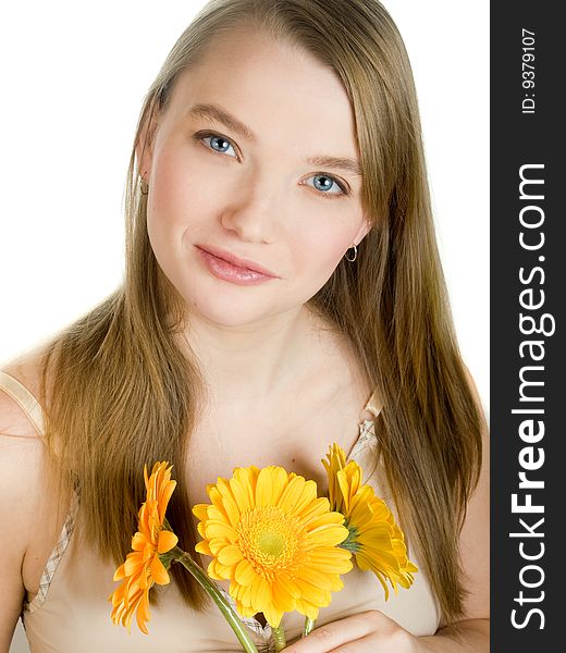 Smiling girl with yellow flowers on white background. Smiling girl with yellow flowers on white background