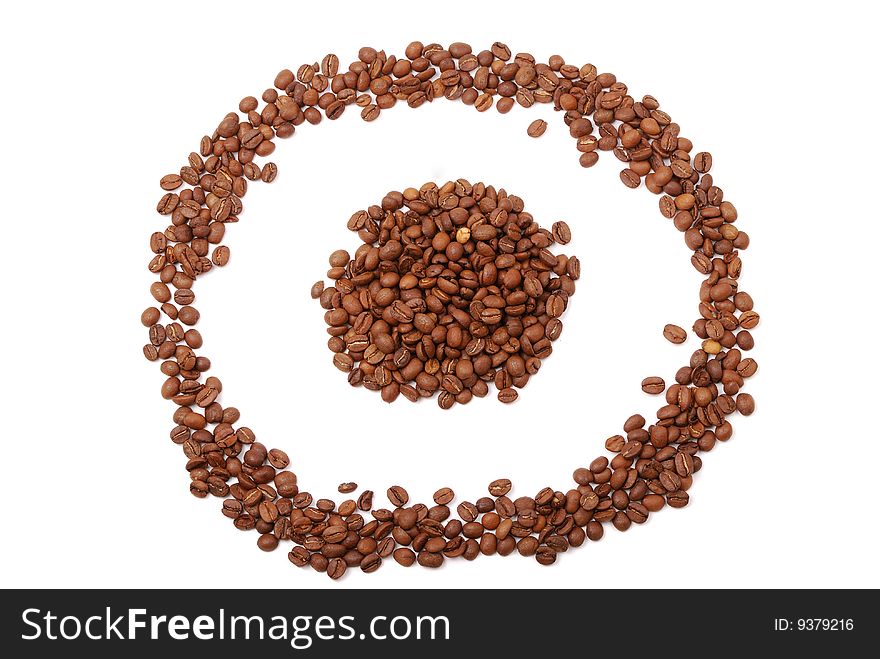 Brown grains of fried not ground coffee in the form of a heap and signs.
