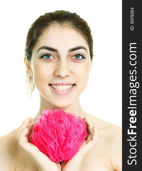 Pretty young brunette woman holding a pink bast in her hands. Pretty young brunette woman holding a pink bast in her hands