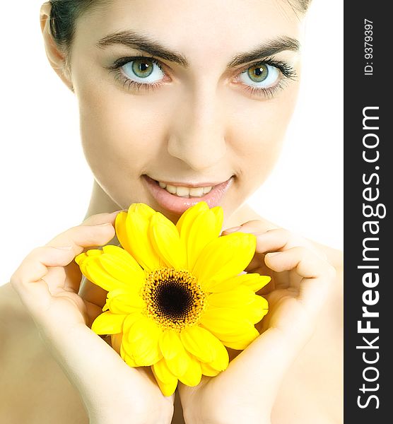 Pretty young brunette woman with a yellow flower. Pretty young brunette woman with a yellow flower