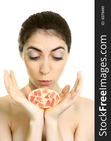 Pretty young surprised woman holding a soap in her hands. Pretty young surprised woman holding a soap in her hands