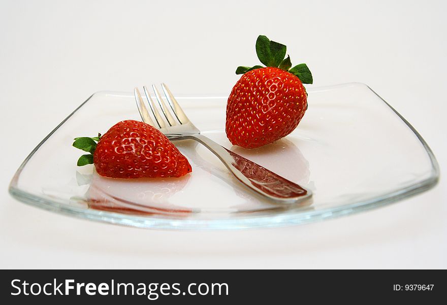 Strawberry on a plate with a plug