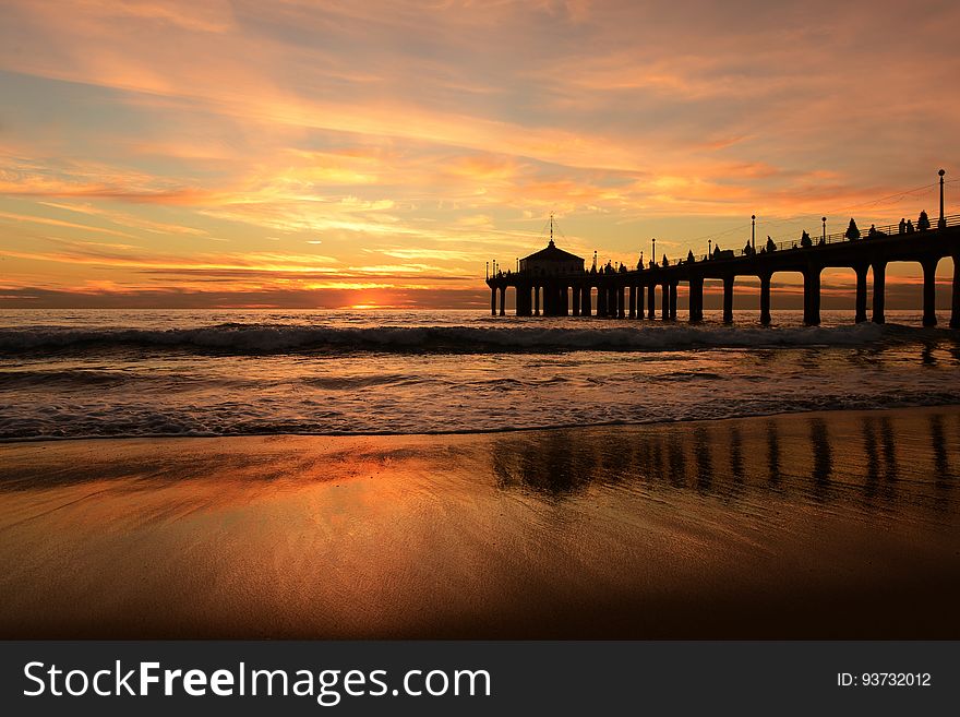 Brown Wooden High Rise Dock Near The Ocean