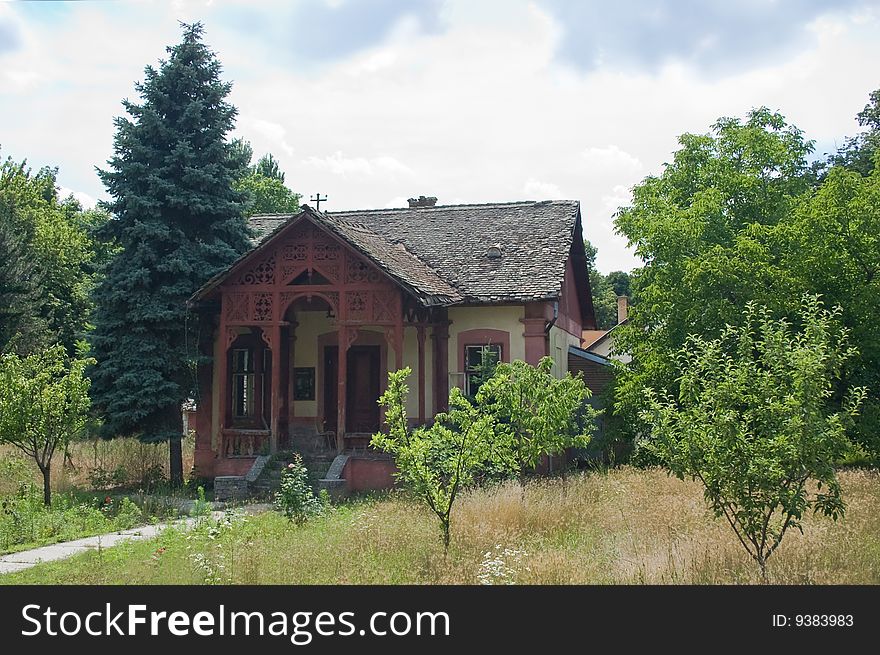 Photo of an old house in trees with broken roof.
nobody lives in it. Photo of an old house in trees with broken roof.
nobody lives in it.
