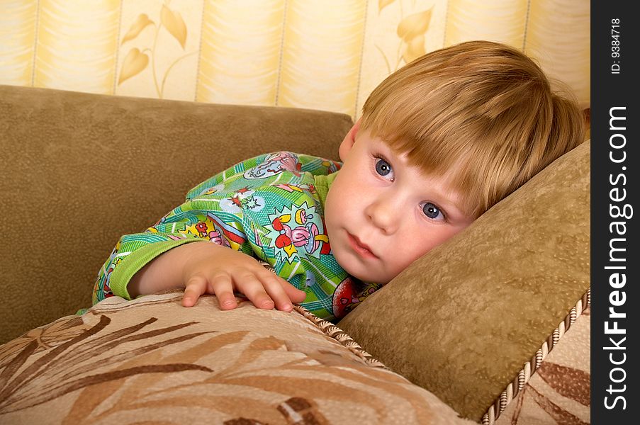 The little boy with a pensive sight. The little boy with a pensive sight