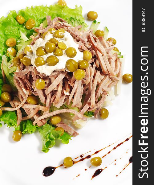 Green Peas and Meat Salad Served with Salad Leaves and Sauce