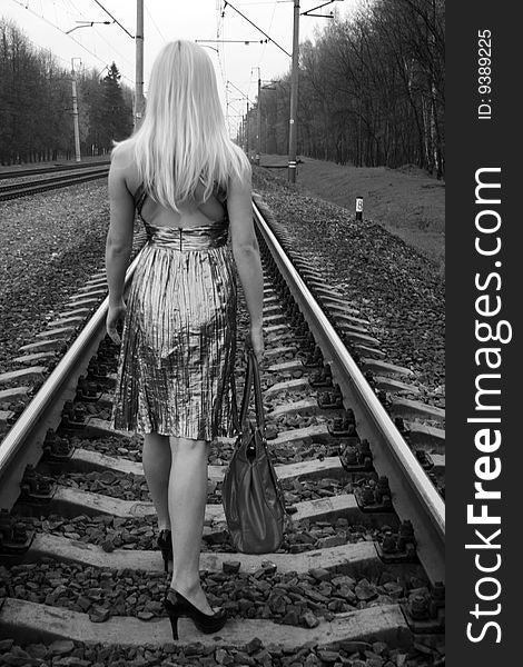 Pretty girl traveling by railroad